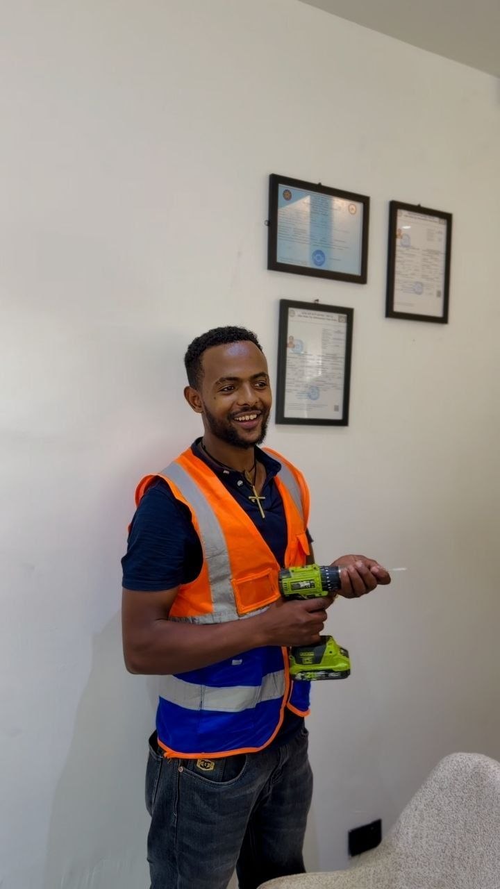 KMG certified technician with power drill