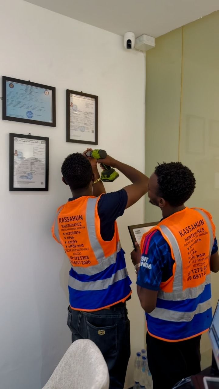 Technicians installing equipment