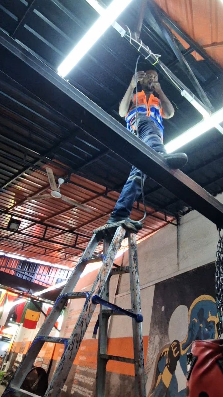 Ceiling wiring on ladder